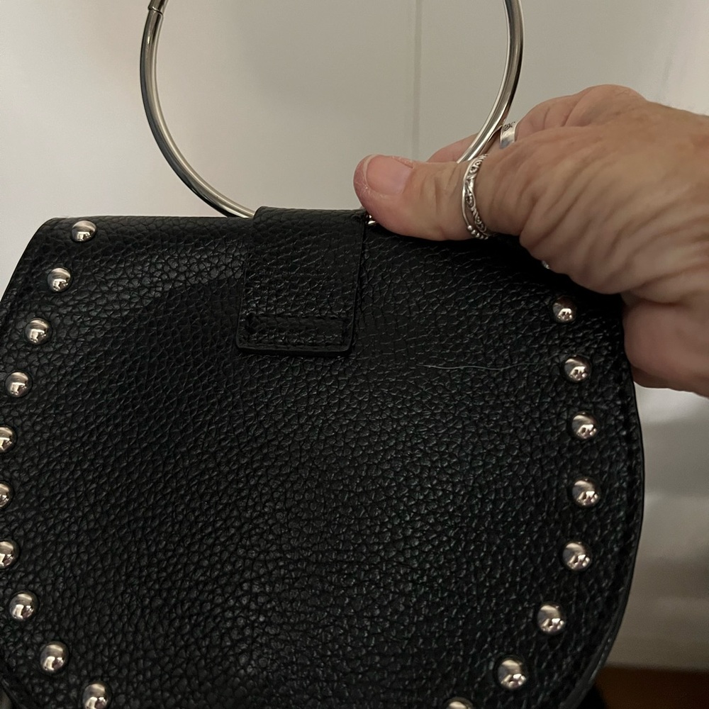 Very small clutch. Black with animal print and stuf detail
